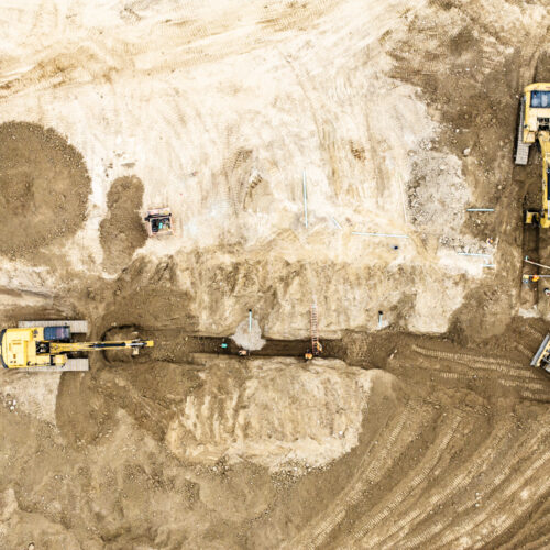 OSWCA, aerial shot of dirt worksite, trench, excavators, dozer, 24053_BUILDWITT_3629